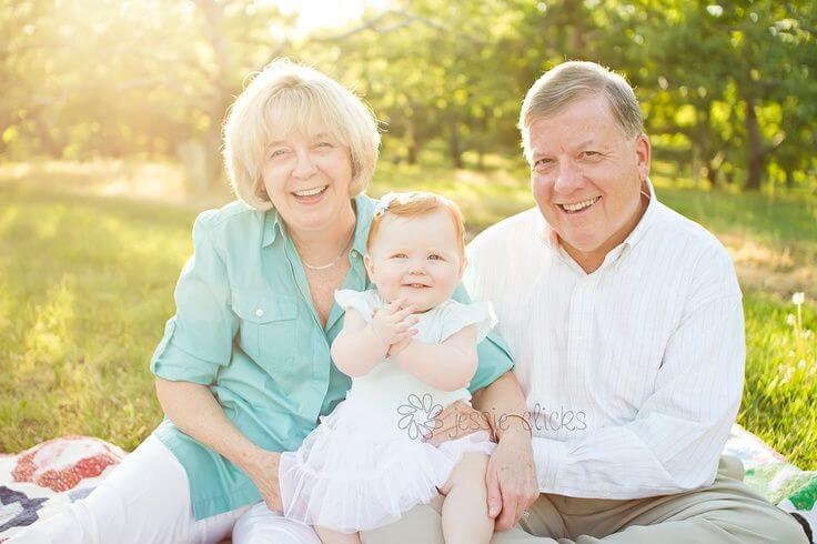 Grandparents with their granddaughter.