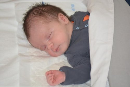 A newborn sleeping peacefully.