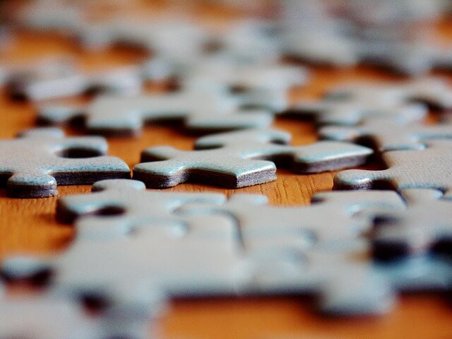 Puzzle pieces on a table.