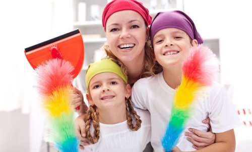 Cleaning taskforce - woman with kids holding utensils