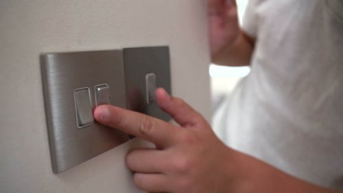 856803758-light-switch-turning-off-procedure-9-12-years-electricity-energy