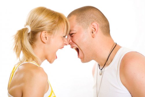 Angry twenty something couple yelling at each other