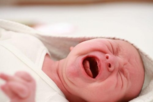 A crying newborn.