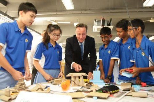 SINGAPORE - JULY 29: British Prime Minister, David Cameron (3rd L) engages with students during a Design & Technology lesson for a class of Lower Secondary School at the Commonwealth Secondary School on July 29, 2015 in Singapore. Prime Minister, David Cameron is on a two day official visit to Singapore, the second of his four nation tour of South-East Asia, to secure trade deals and foster political alliance to counter the Islamic State group. (Photo by Suhaimi Abdullah/Getty Images)