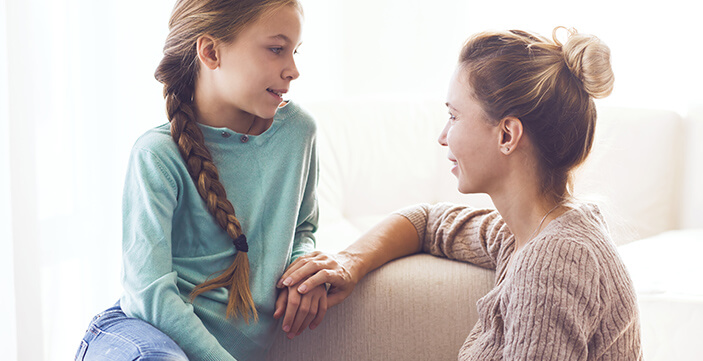 A mother having a heart to heart conversation with her daughter.