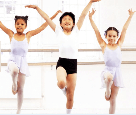 Three children in a dance class.