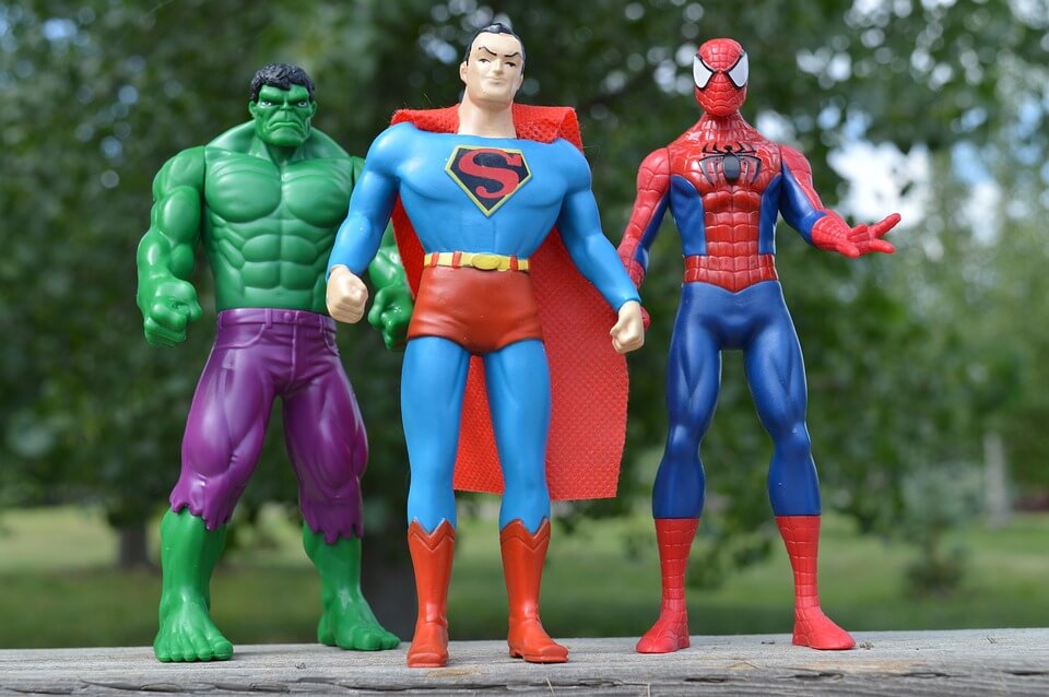 Action figures of Superman, Spiderman, and the Hulk.