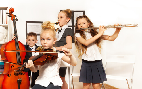 Children playing musical instruments.