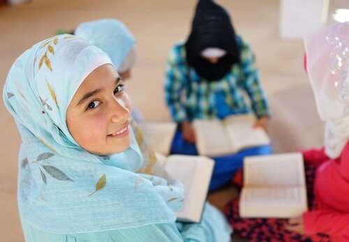 Muslim girls reading books.
