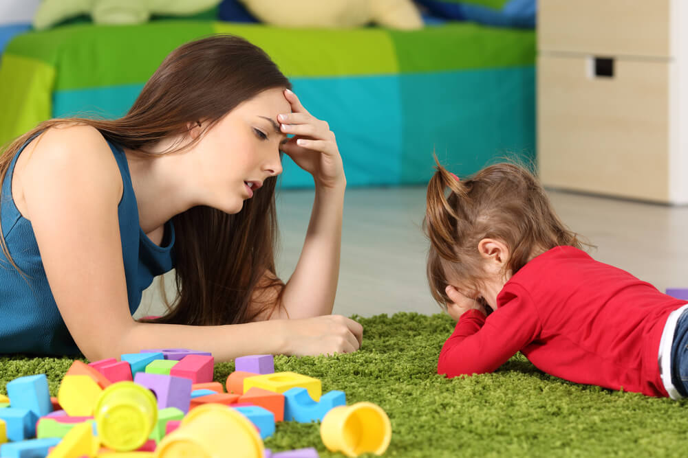 A mother who's tired because her toddler daughter can't tolerate frustration.