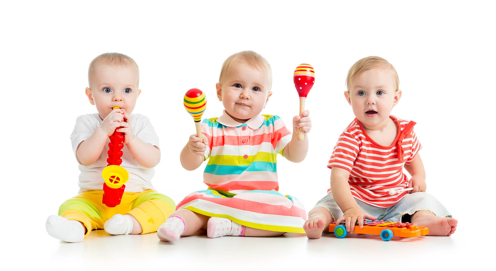 Babies playing with musical toys.
