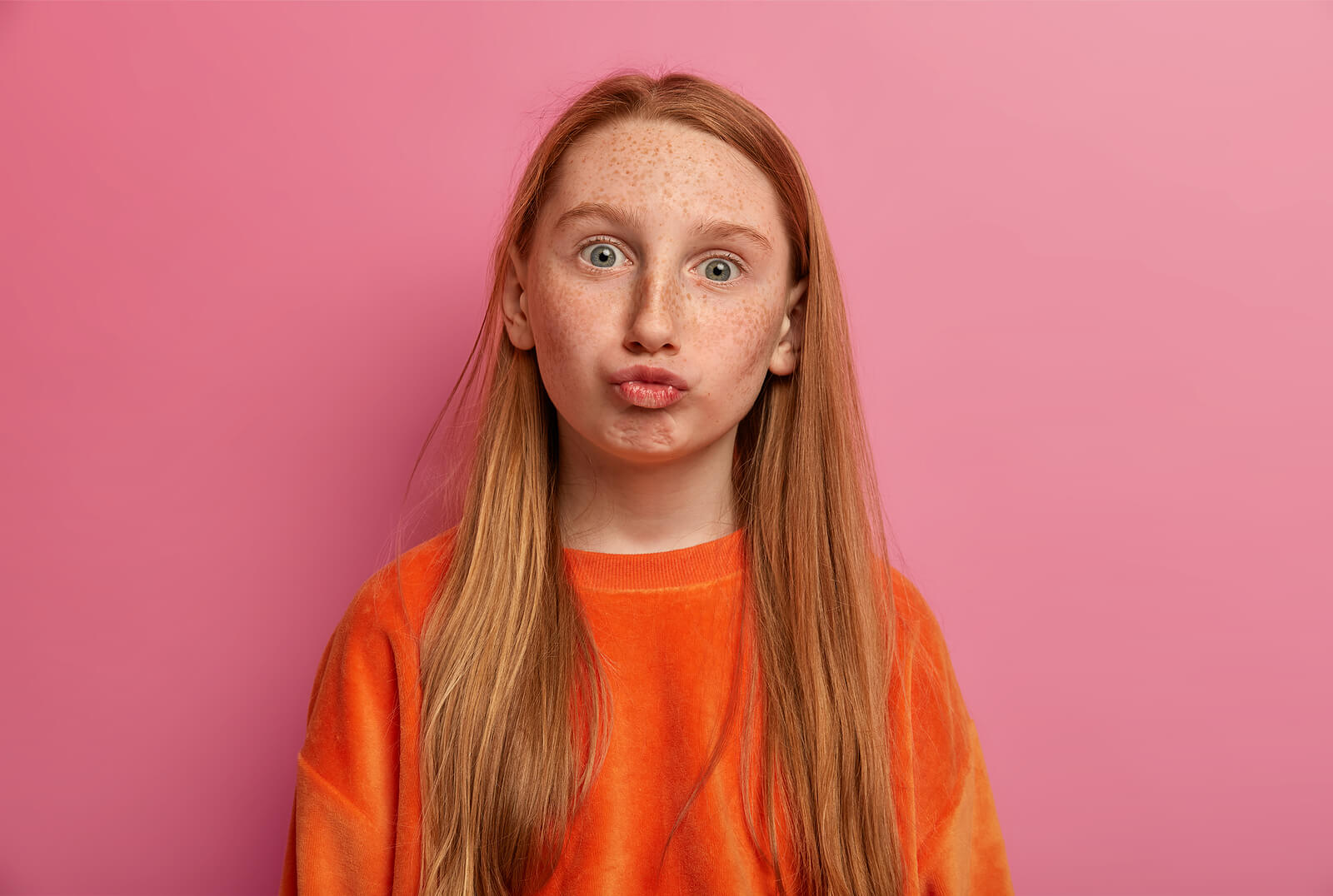 A red-headed teen with freckles.