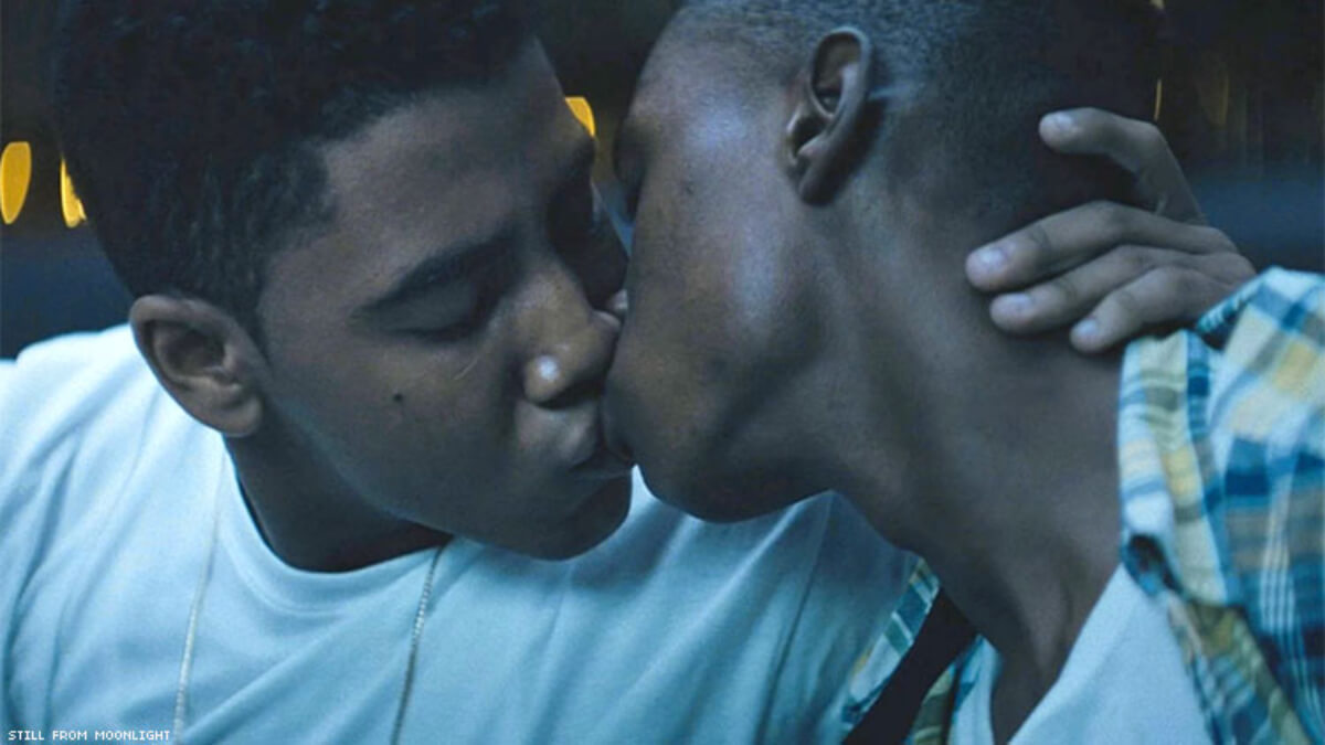 A scene from a movie with two men kissing.