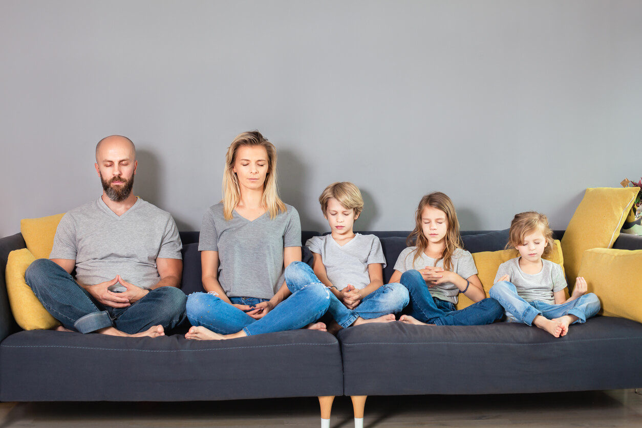 A family of five practicing mindfullness.