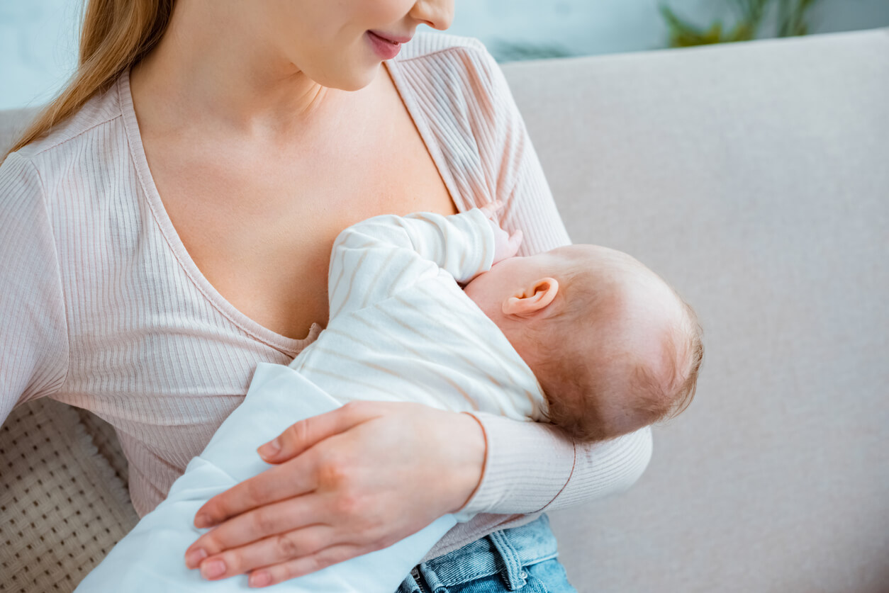 A woman breastfeeding her baby.