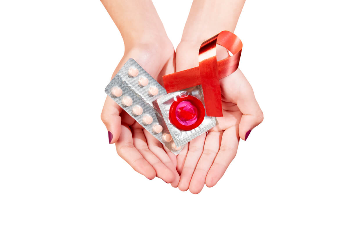 prevencion conciencia ets enfermedad transmision sexual vida sexual salud reproductiva sida vih cinta roja manos pildoras pastillas anticonceptivo condon mano roja
