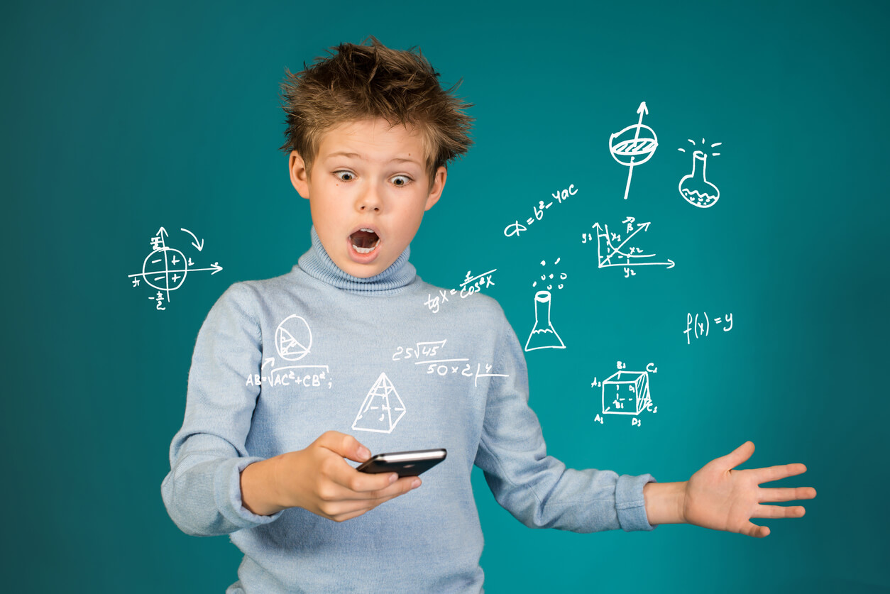 A child using a phone app to learn chemistry.