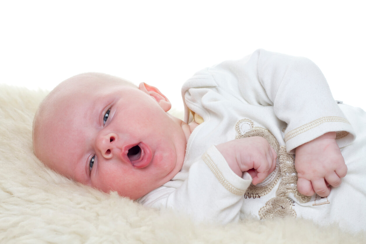 A newborn baby coughing.