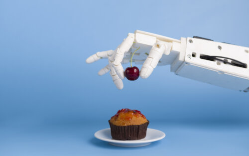 mano robot inteligencia artificial coloca cereza en pastel