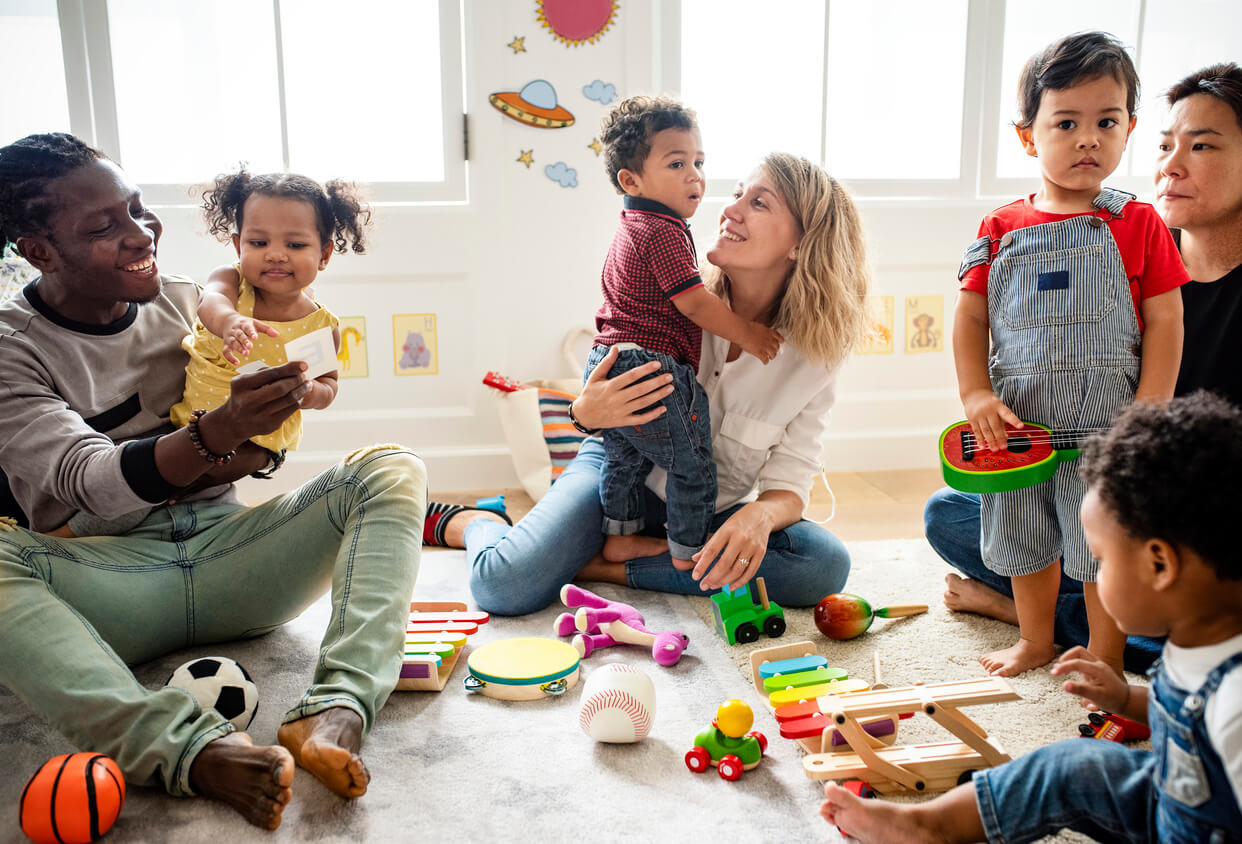 Parents with their children in daycare.