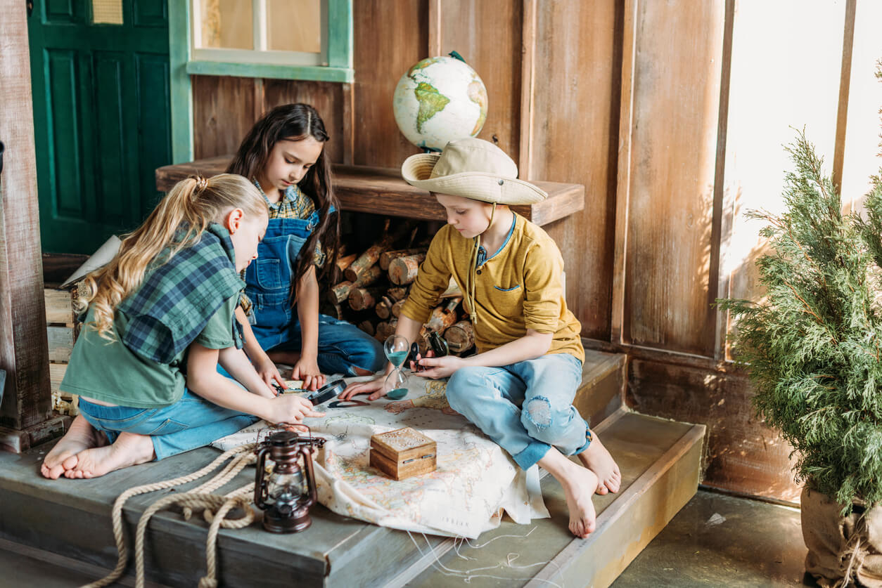 Children looking at an old map.
