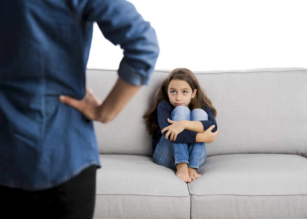A mother scolding her daughter.