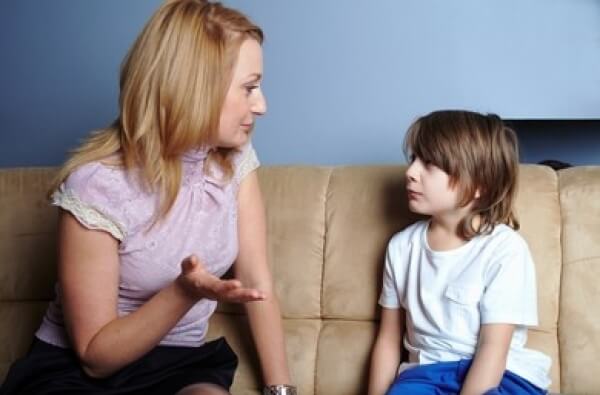 A mother having an important conversation with her young son.
