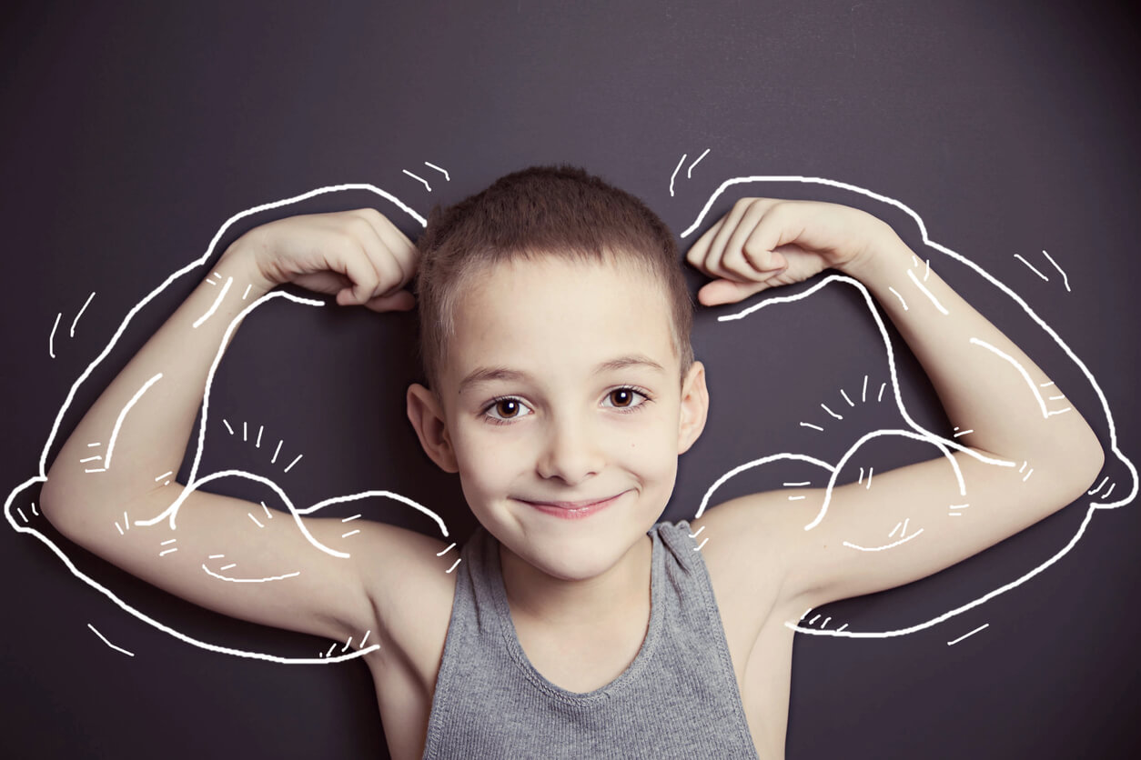 A child showing off his muscles.