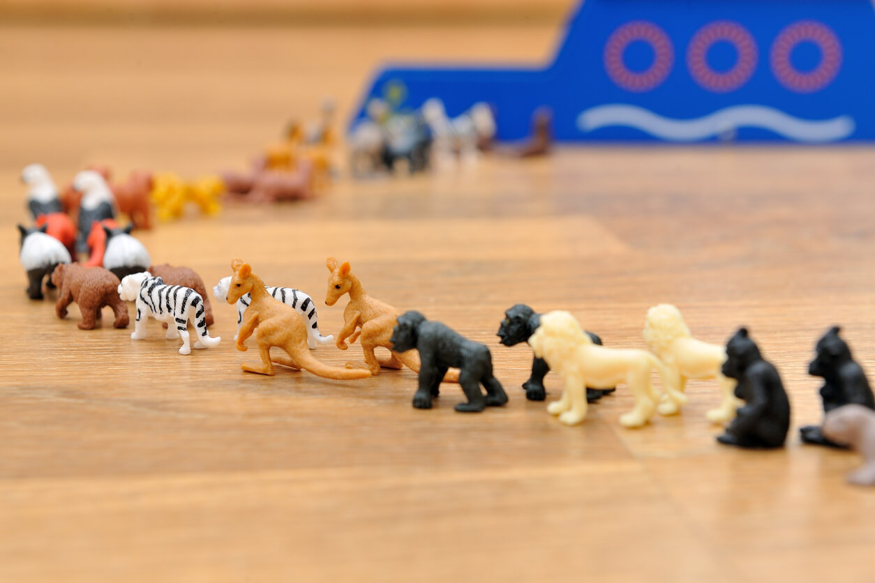 Animal figurines lined up two by two.