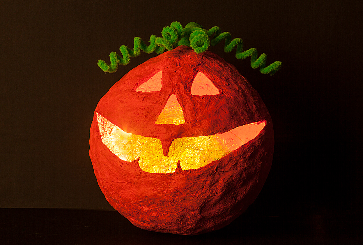 A paper mache jack-o-lantern.
