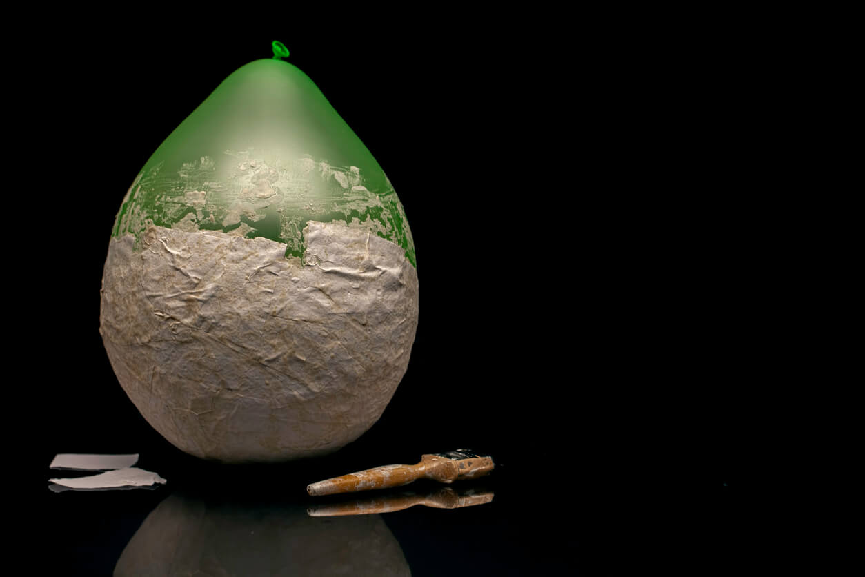 A balloon covered in paper mache.