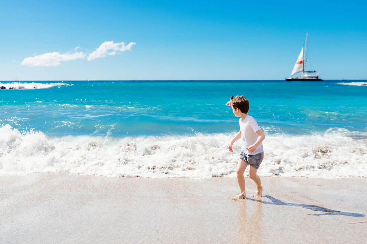 A boy on the beach of the Canary Islands.
