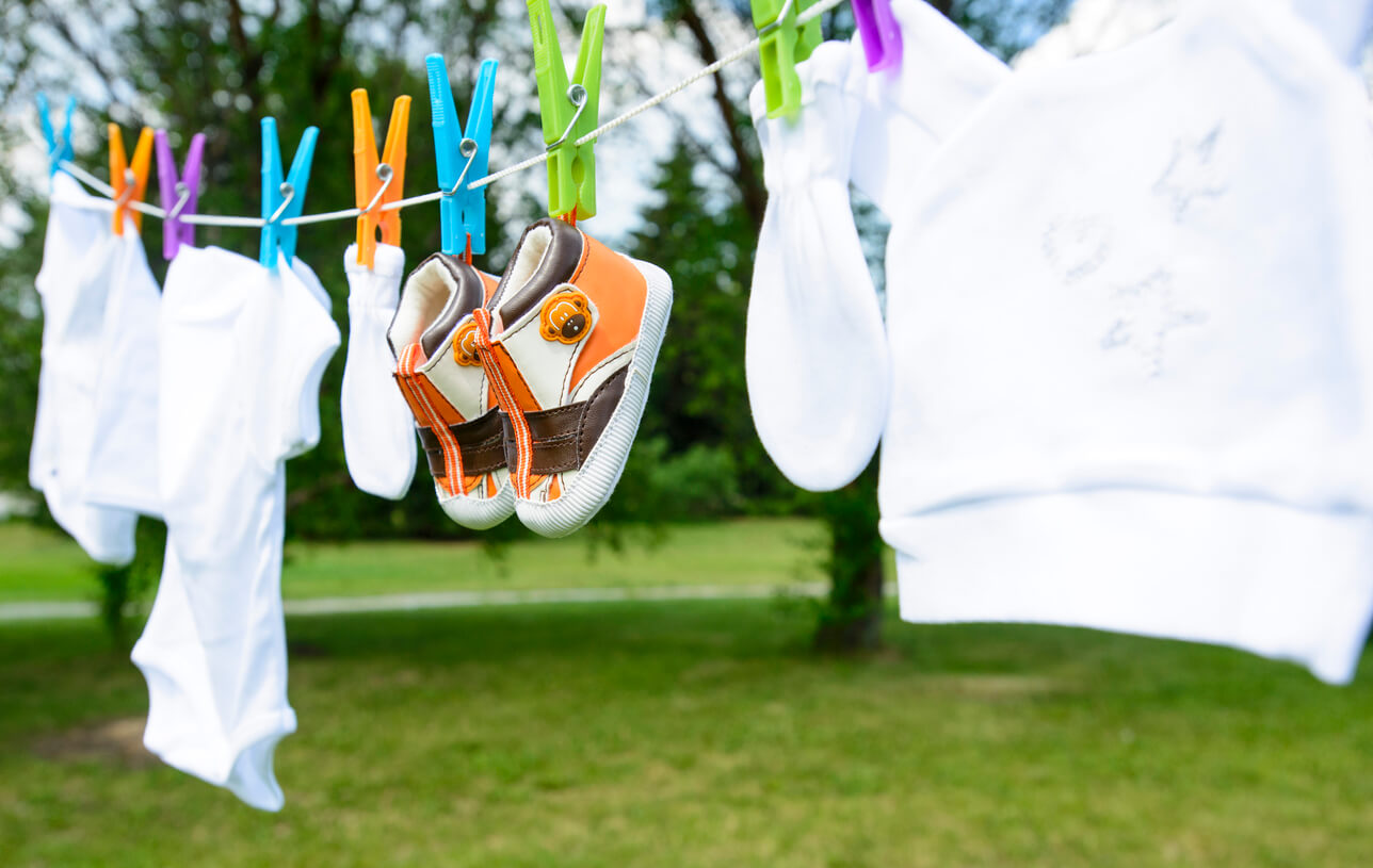 Baby clothes hanging on the clothes line.