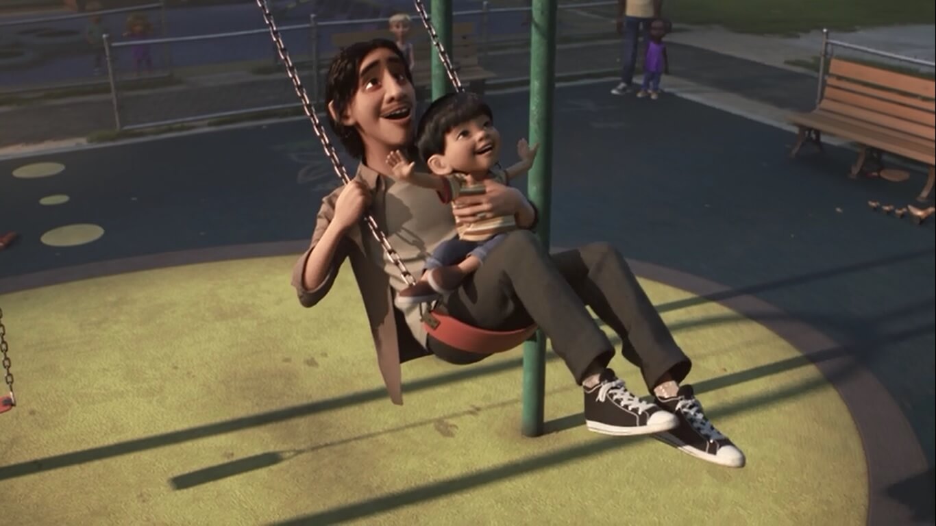 A scene from Float where the father and his son swing together on the playground.