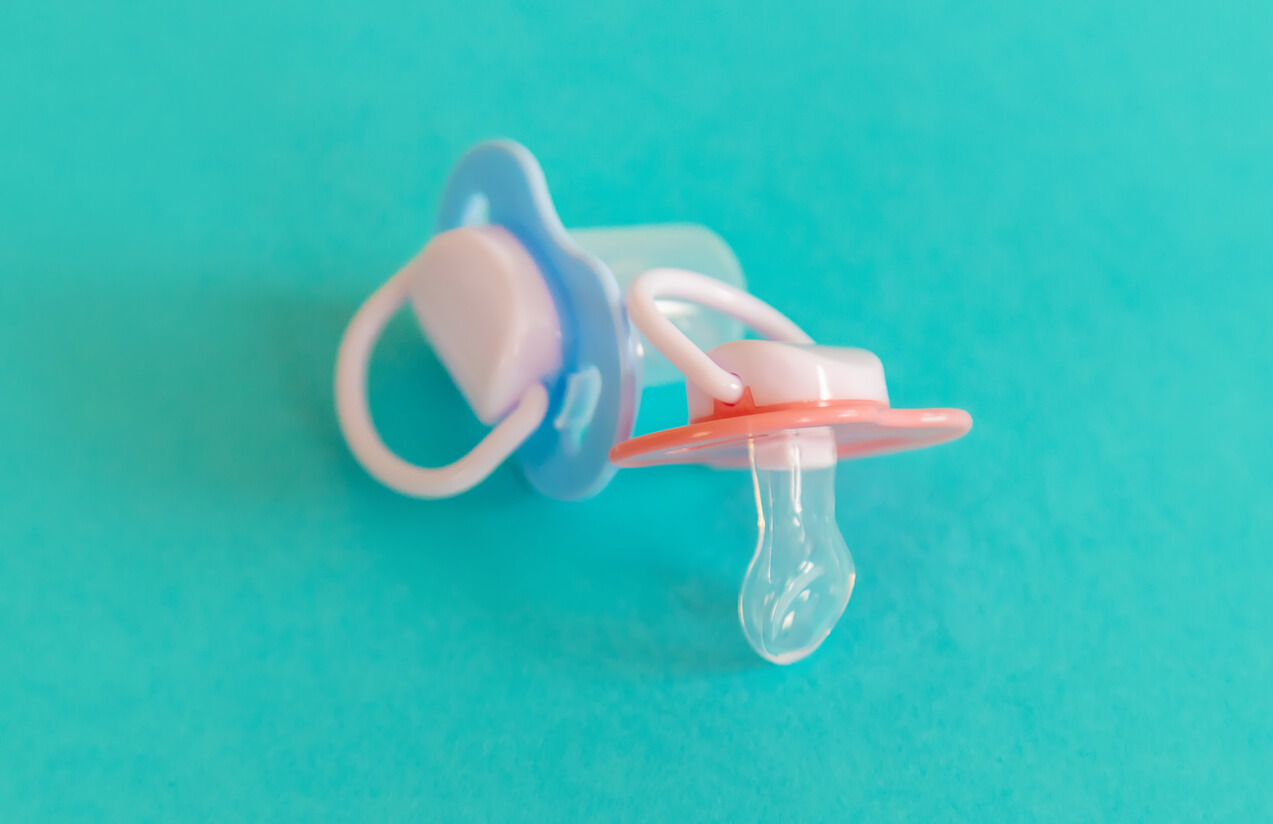 Two baby pacifiers.