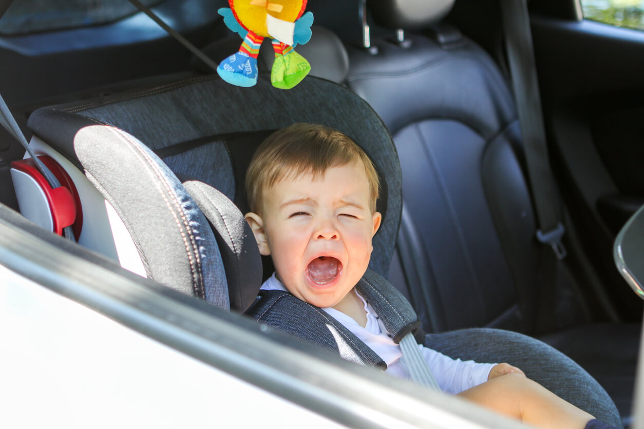 A toddler crying in his carseat.