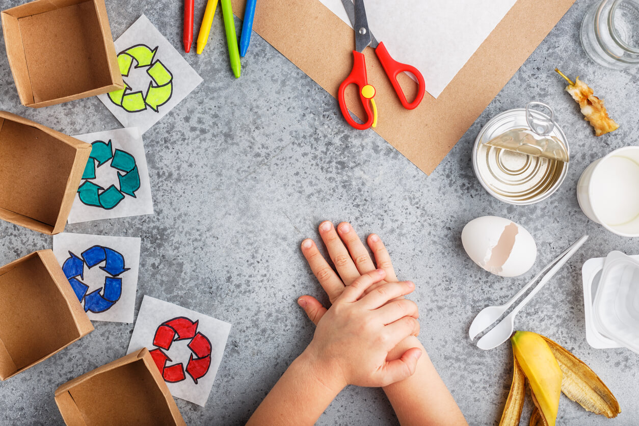 A child separating recycleable materials from non-recycleable materials.