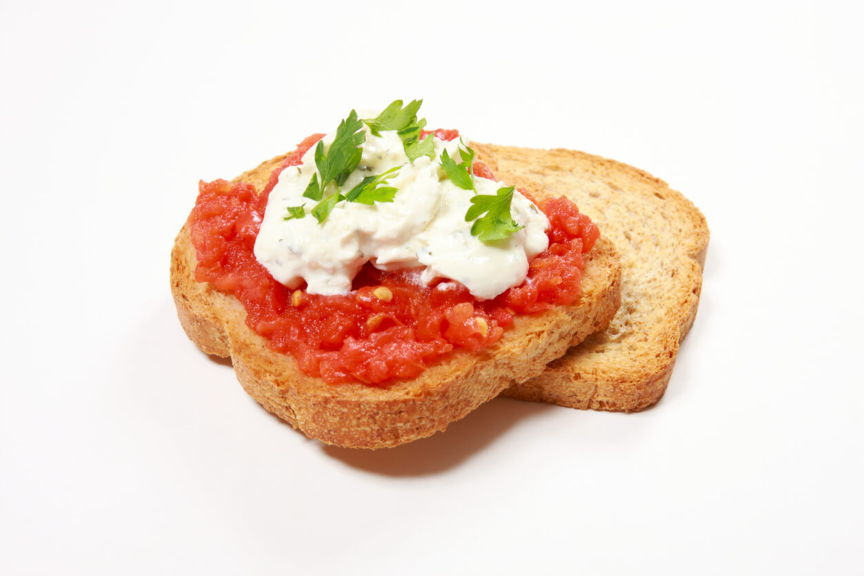 Tomato, cheese and parsley on toast.