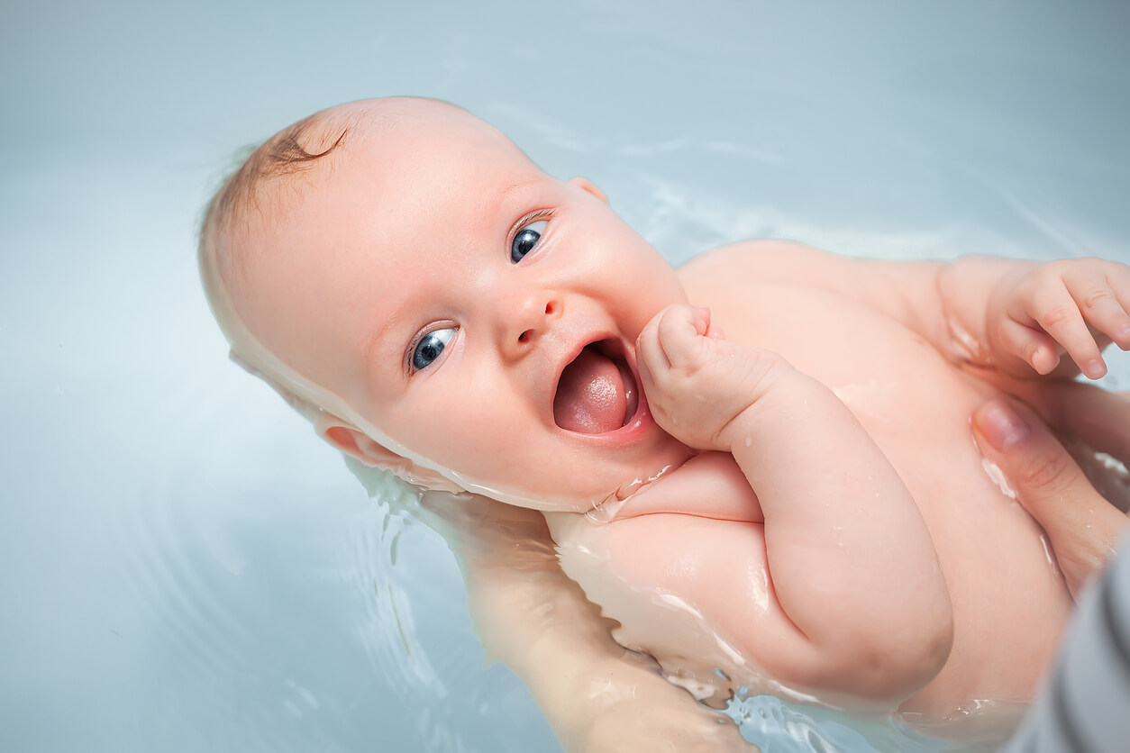 A baby taking a bath.