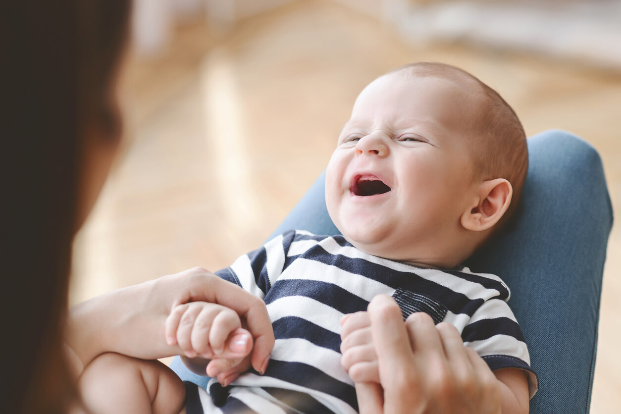 A newborn laughing.