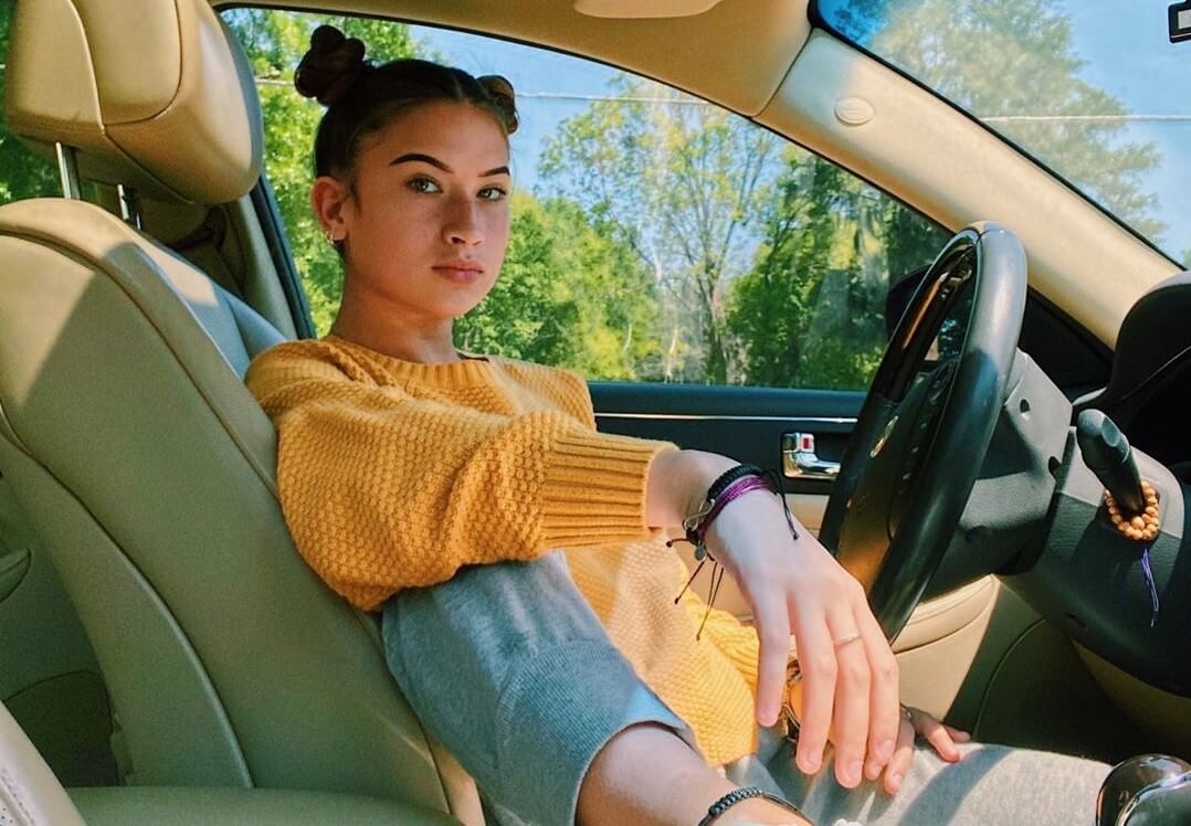 Hannah Rylee sitting in a car.