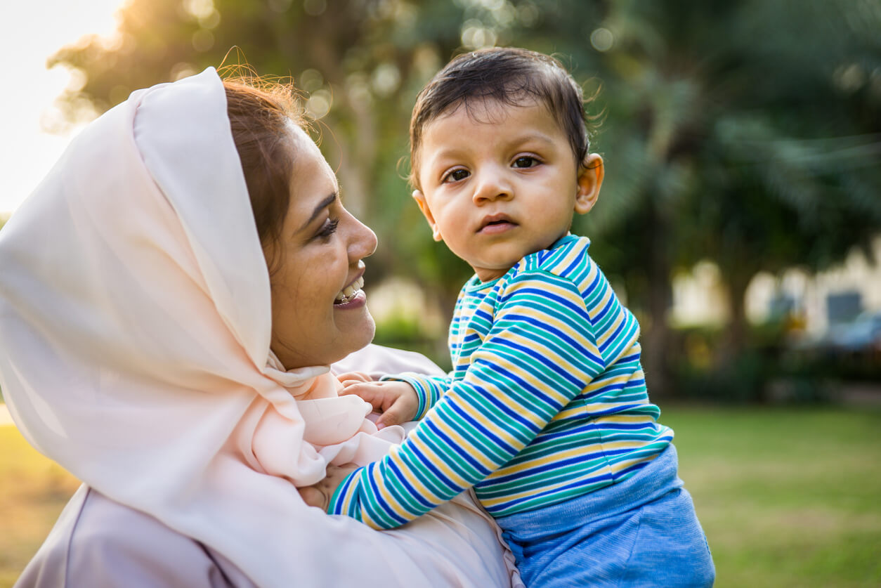 A Persian mother holding her son.