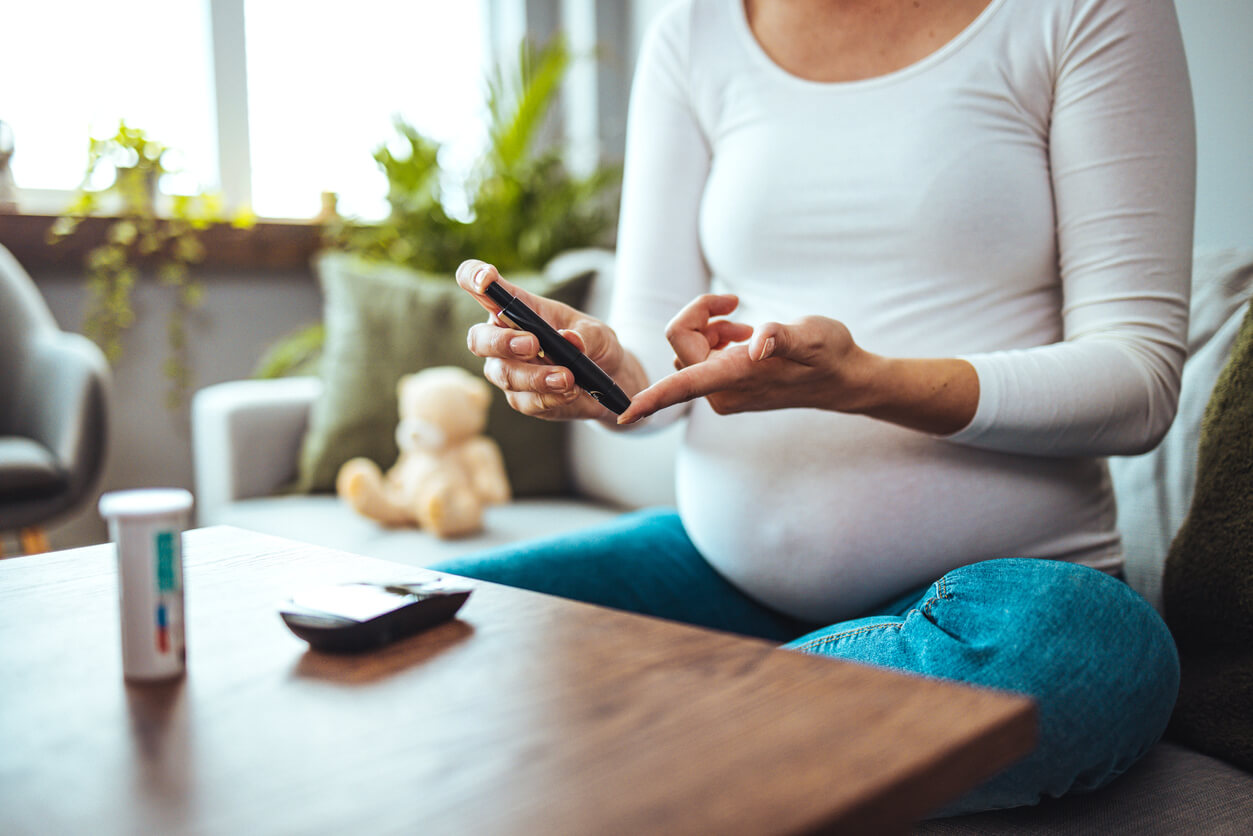 A pregnant woman checking her blood sugar.