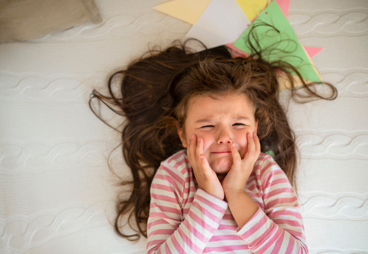 A little girl with a toohache.