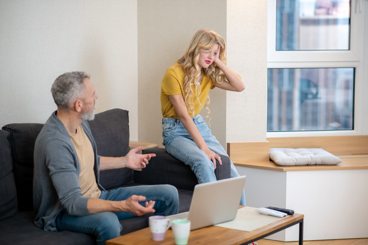 A father and his teenage daughter having an argument.