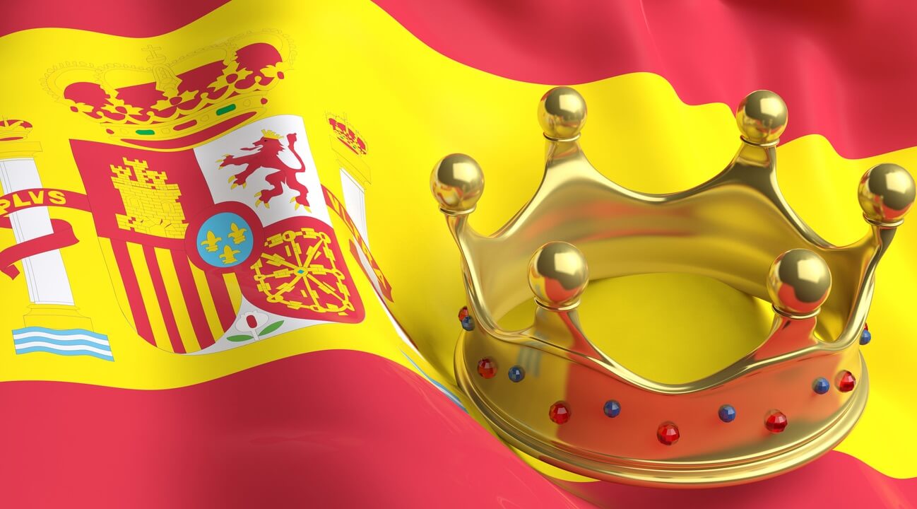 A crown sitting on a Spanish flag.