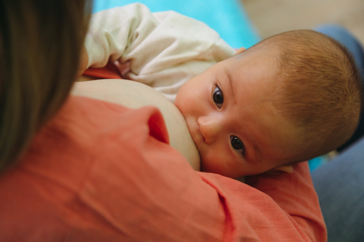 A baby breasteeding.