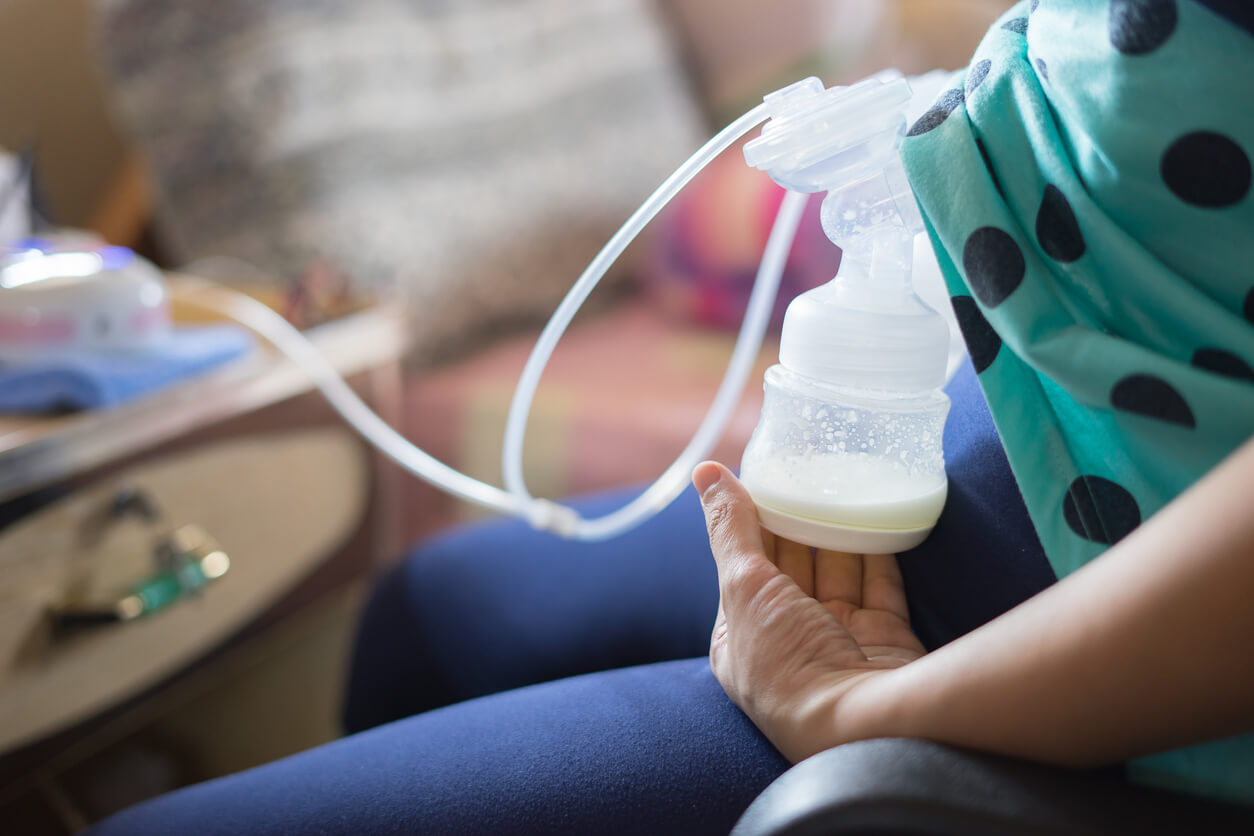 A woman pumping milk.