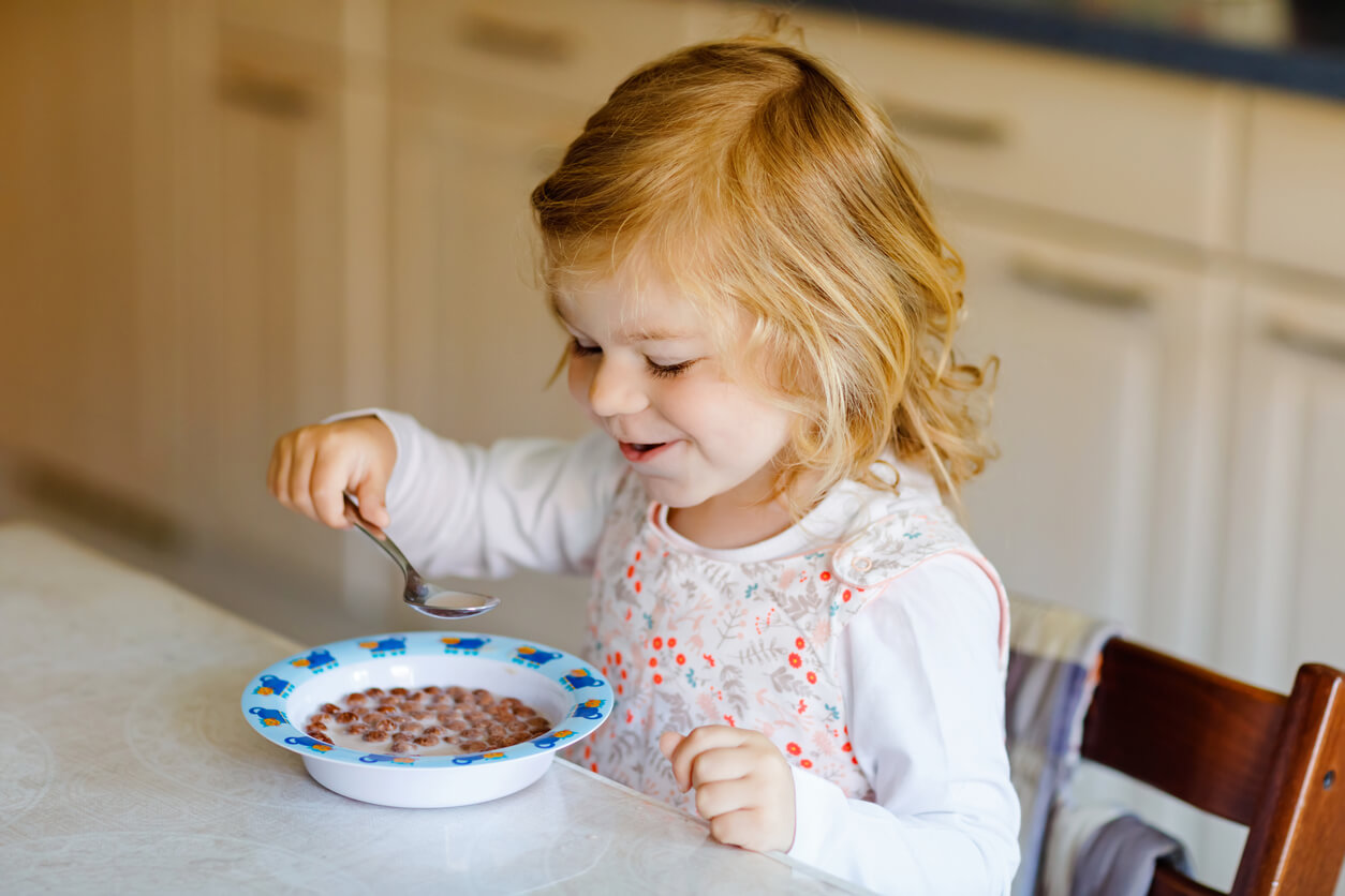 A child eating cereal.