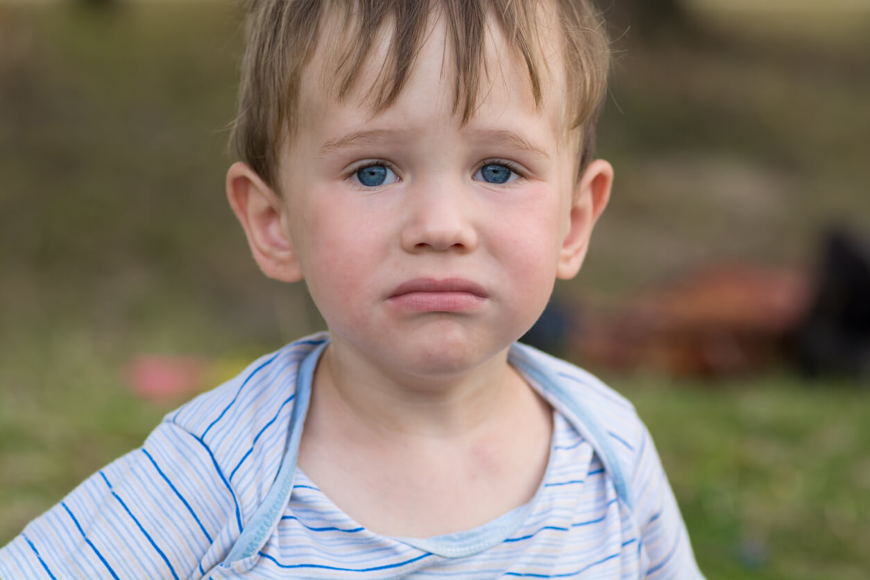 A child pouting without tears.